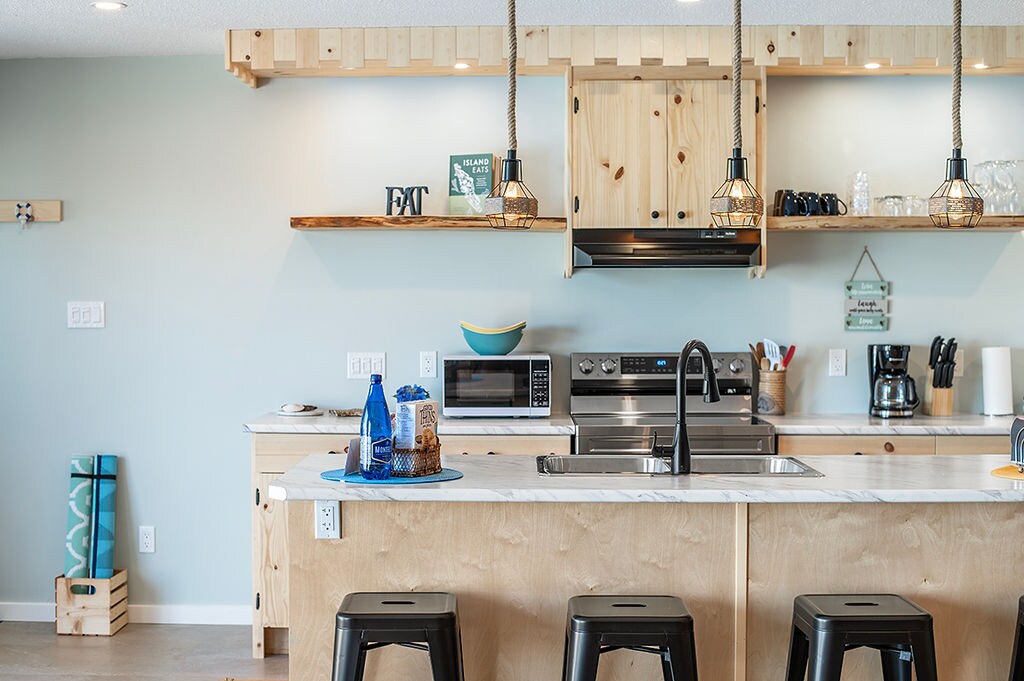 The Whale House kitchen island with bar stools